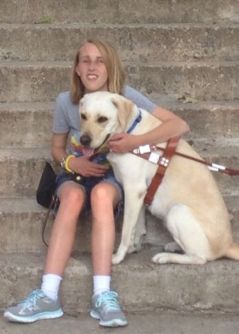 Photo of Danielle Burton and her guide dog, Yellow Lab, Willa